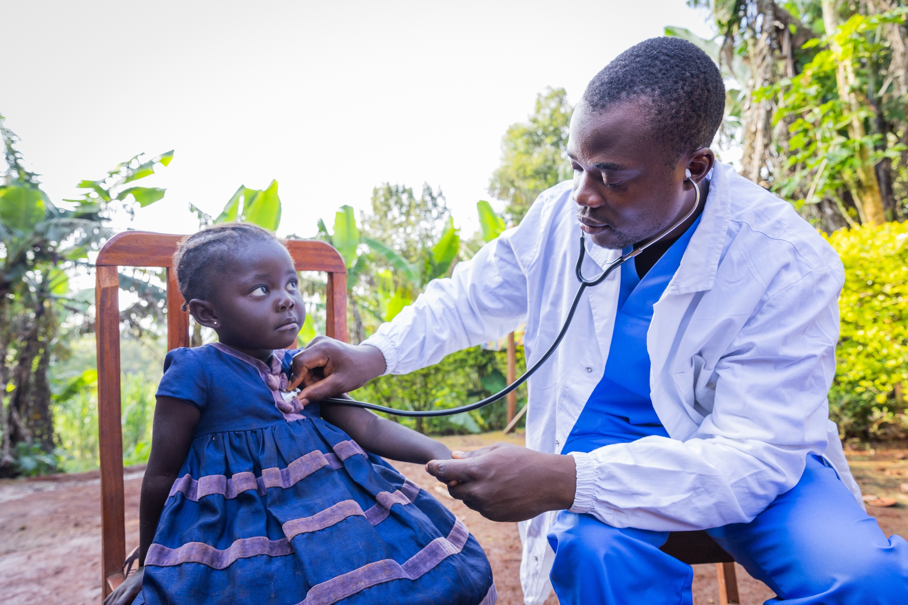 Doctor examining a child for a community health visit