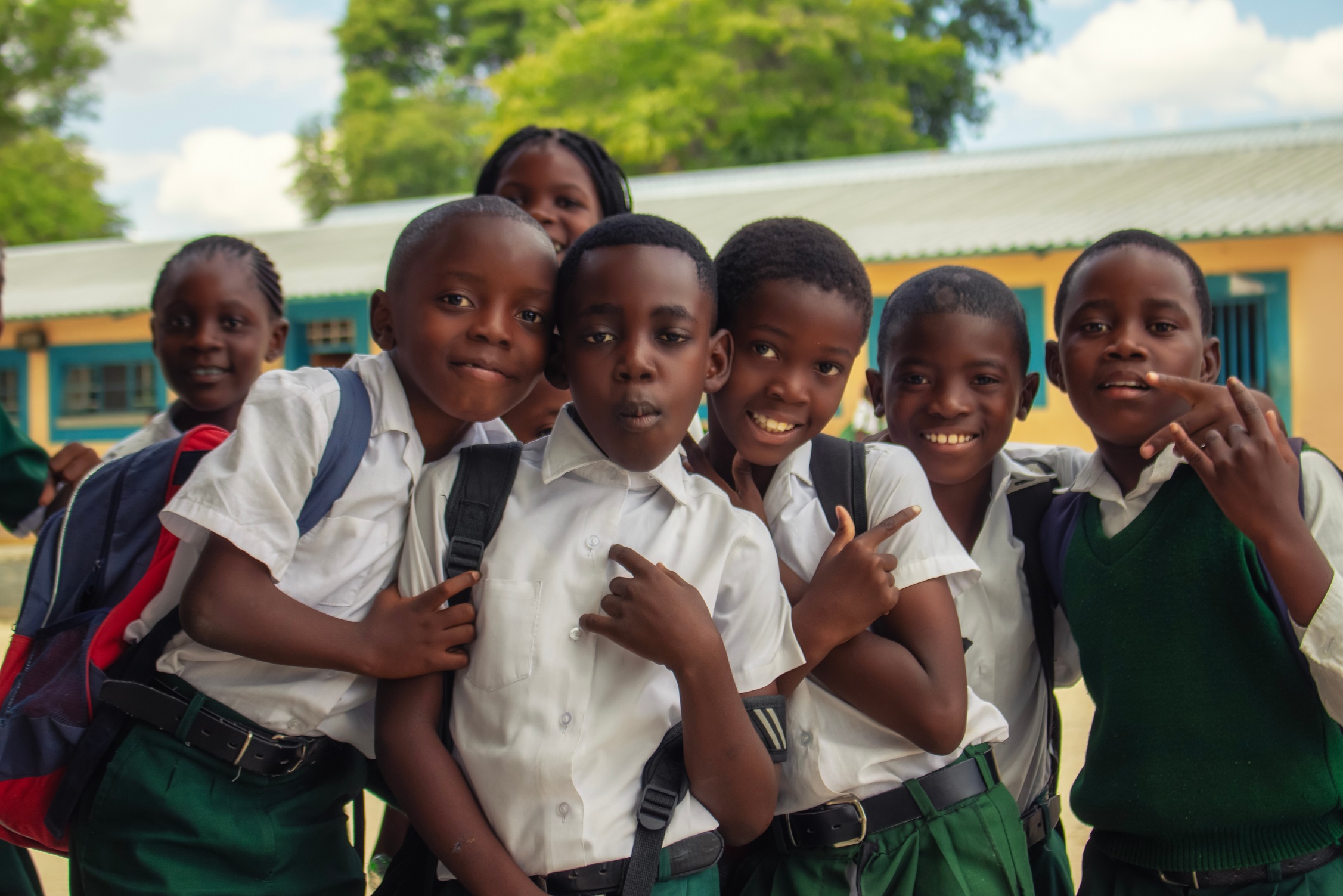 Students standing together outside a school